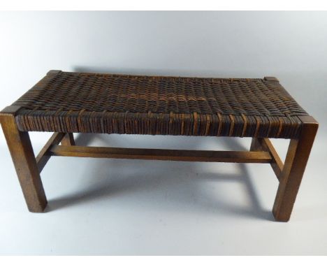 An Early 20th Century Arts and Crafts Stool with a Painted Leather Willow Seat, Bearing the Label Lady Griffiths 1925. 70cm L