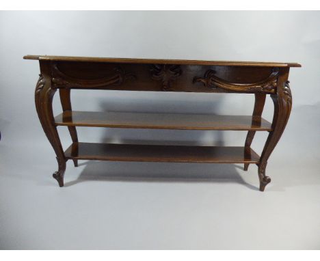 An Edwardian Mahogany Two Shelf Open Bookcase with Carved Cabriole Supports and Scrolled Feet. 144cm Wide.78cm High