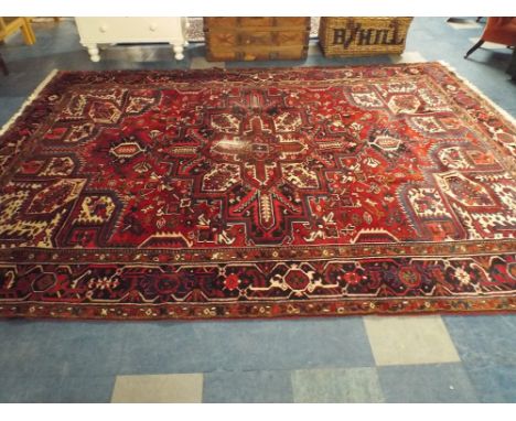 An Antique Persian Heriz Carpet. 343x251