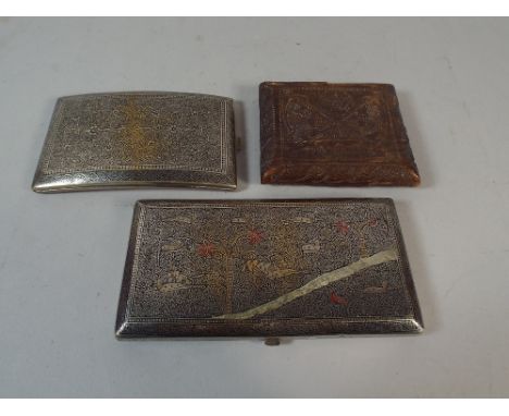 Two Silver Plate Indian Cigarette Cases with Typical Scrolling Decoration to One, River Scene with Tigers Hunting Antelope to