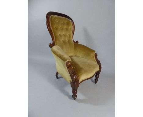 A Victorian Balloon Back Mahogany Framed Ladies Armchair with Button Upholstery.