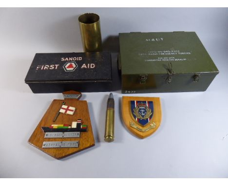 A Collection of Militaria to include Oak Plaque for M.V Astronomer, Falklands 1982, First Aid Tin with Contents, Shell Case E