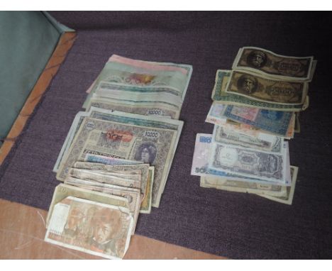 A collection of vintage used World Banknotes