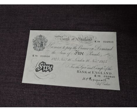 A Bank of England 1945 White Five Pound Note, chief cashier K.O.Peppiatt, K79 032850, small sticky patch on reverse, uncircul