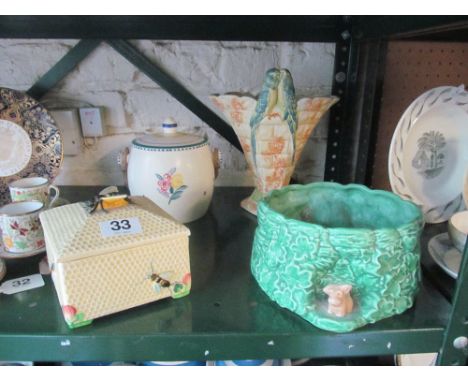 A SylvaC jardinière with dog, a Kensington Ware budgie vase, a Poole Pottery biscuit barrel, a Crown Devon bee preserve pot a