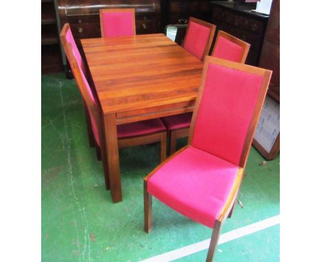 An Ercol table and six chairs with extra leaf