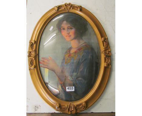 An oval portrait of lady in gilt frame