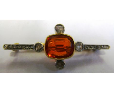 An Edwardian diamond brooch with central possible fire opal