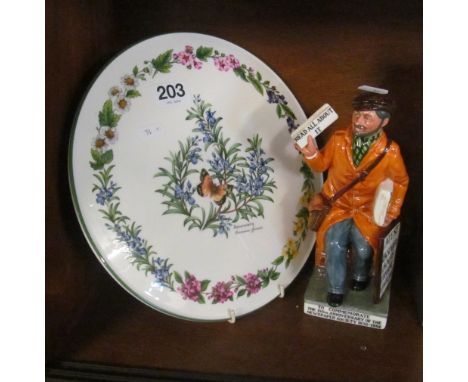 A limited edition Royal Doulton figure 'The News Vendor' HN2891 2273/2500 and a Royal Worcester cake plate