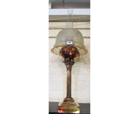 A copper and brass paraffin lamp modelled as a Corinthian column