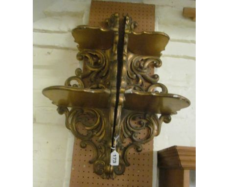 A pair of Victorian carved gilt-wood corner shelf brackets