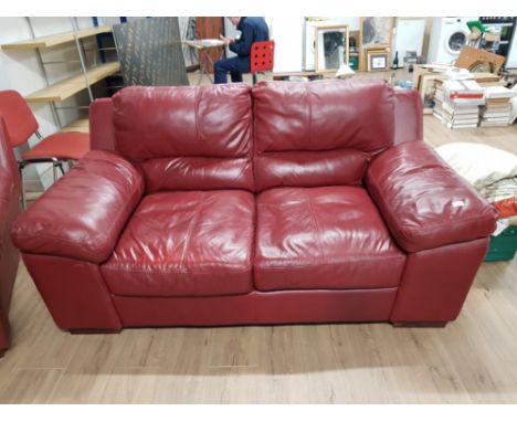 A MODERN 3 PIECE RED LEATHER SUITE IN THE MANNER OF BARKER AND STONEHOUSE, AND A MATCHING FOOT STOOL