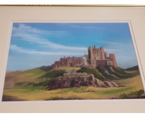 A FRAMED PASTEL DRAWING OF BAMBURGH CASTLE BY JD PARRACK SIGNED BOTTON RIGHT 30CM BY 32CM