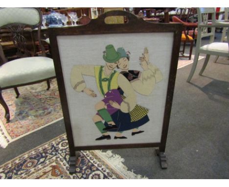 An oak framed fire screen with a fabric panel depicting figures
