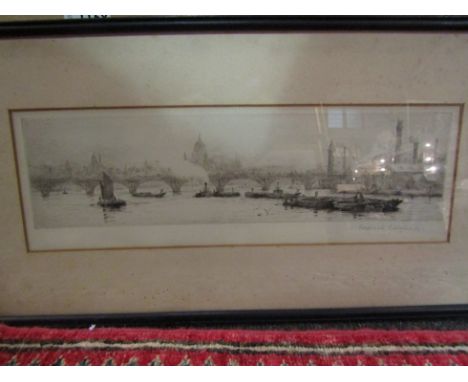 ROLAND LANGMAID (1897-1956) A signed etching depicting barges on the river Thames with St. Pauls in background, framed and gl