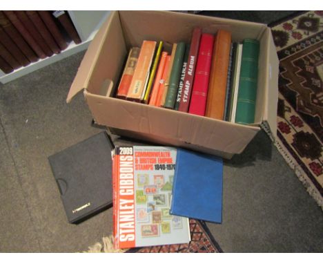 Two boxes of stamp related reference books, albums and contents including mid 20th Century commonwealth examples