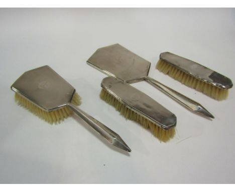 A silver backed 4 piece brush and mirror set, damaged