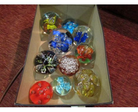 A selection of glass paperweights including Langham, Caithness etc.