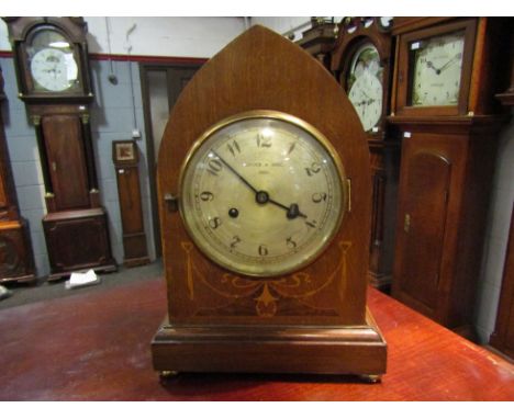 An Edwardian inlaid mantel clock by Livock &amp; Moss, Diss. Keys and pendulum in back