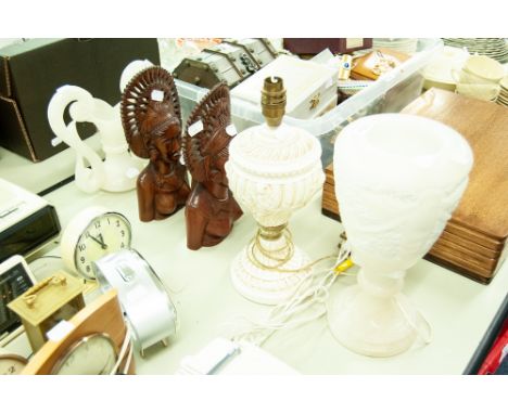 A WHITE ONYX URN AS A TABLE LAMP, A PAIR OF HARDWOOD SOUTH SEAS (BALI) FEMALE HEADS   AND A TABLE LAMP 