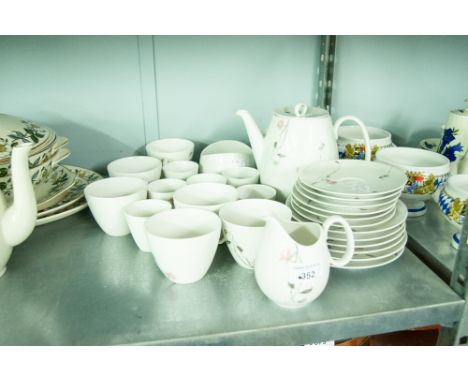A GERMAN TEA SERVICE 'QUINCE' PATTERN, FOR SIX PERSONS AND A SET OF FOUR WEST GERMAN SOUP BOWLS ON STANDS 