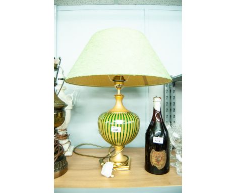 A MODERN TABLE LAMP HAVING GILT STAND WITH GLASS BALLOON STRIPED INSERT WITH GREEN SILK SHADE 