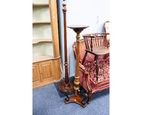 EARLY TWENTIETH CENTURY CARVED MAHOGANY TORCHERE, with part fluted column, the tripod support with claw and ball feet, togeth