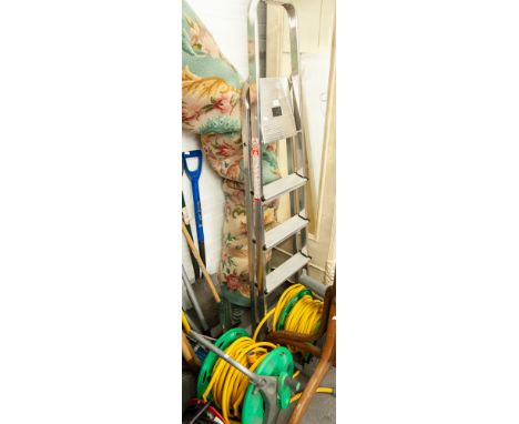 A HOZELOCK GARDEN HOSE AND A ALUMINUM FOUR STEP COLLAPSIBLE LADDERS AND ANOTHER HOSE PIPE (3) 