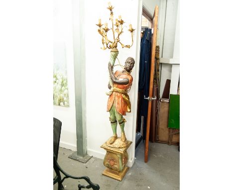 A MODERN BLACKAMOOR FLOOR LAMP DESIGNED AS A FIGURE OF AN AFRICAN AMERICAN GENTLEMAN HOLDING A CORNUCOPIA ALOFT HAVING SEVEN 