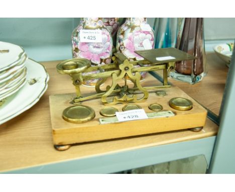 A SET OF VICTORIAN LETTER SCALES WITH SIX BRASS WEIGHTS ON WOODEN PLINTH BASE, BEARING PLAQUE 