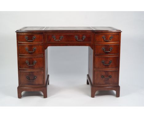 MODERN REPRODUCTION GEORGIAN STYLE FIGURED MAHOGANY TWIN PEDESTAL LADIES DESK, The moulded top inset with gilt tooled 'antiqu