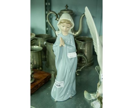 A MODERN NAO PORCELAIN MODEL OF A YOUNG GIRL IN PRAYER 