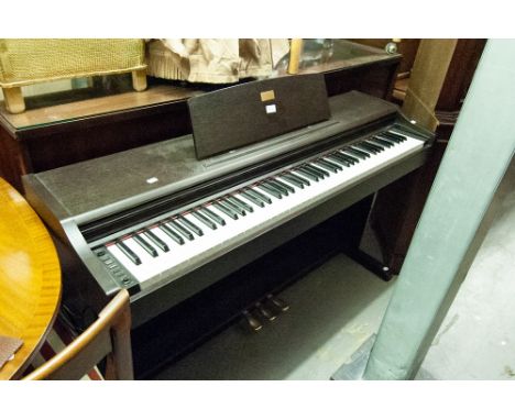 CASIO CELVIANO DIGITAL ELECTRONIC PIANO IN BLACK FLOOR STANDING CASE AND THE PIANO STOOL ON TUBULAR METAL SUPPORTS