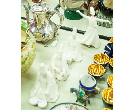 A SET OF FOUR MUSICAL FIGURES IN WHITE BISQUE (4) 