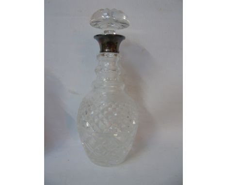 Round cut glass decanter with silver collar