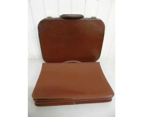 Vintage leather brief case and a small leather case with luggage ticket