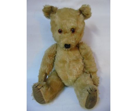 Vintage jointed teddy bear with glass eyes