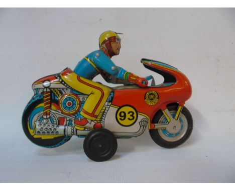 Vintage clockwork tin plate motor cycle and rider
