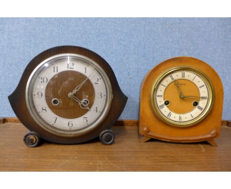 Two oak mantel clocks, two mahogany mantel clocks and an oak wall clock