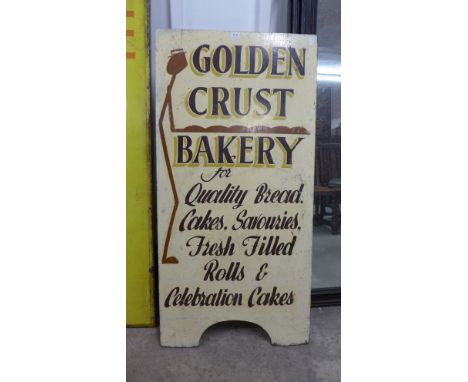 A vintage hand painted Golden Crust Bakery sign