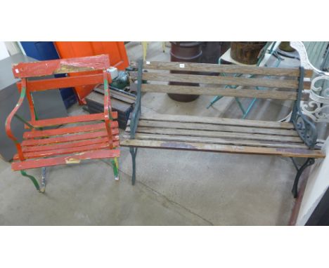 A cast iron ended garden bench and a wrought iron armchair