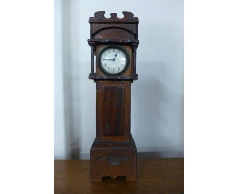 A miniature longcase clock