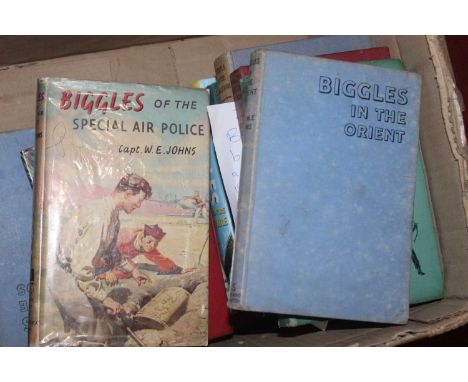 A box of W.E. Johns books (Biggles, Gimlet and Worrell's), to include first edition titles In The Orient, Black Raider, Gimle