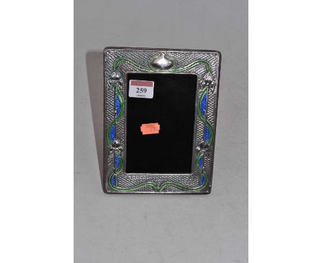 A modern Art Nouveau style silver, green and blue enamelled easel photograph frame, 19.5 x 14.5cm
