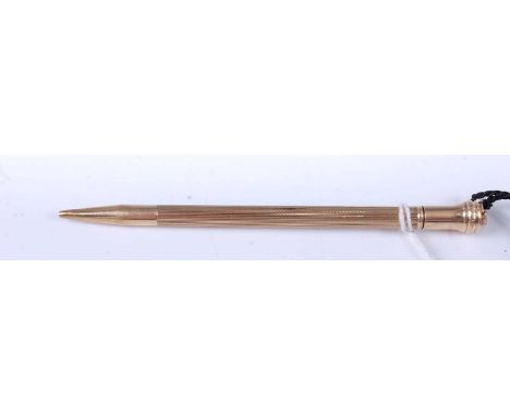 A mid-20th century 9ct gold engine turned propelling pencil, maker C&amp;C, gross weight 13.4g, 10.5cm
