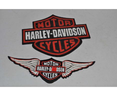 A reproduction cast iron motorcycle advertising sign for Harley Davidson, w.33cm; together with one other for Harley Davidson