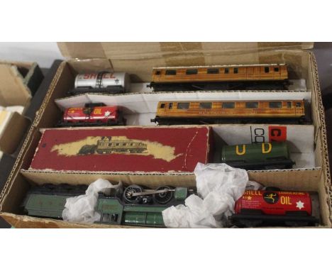 Two boxes of railway related effects, to include diecast models, Trix Twin railway track, British model train books etc 