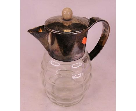 A silver plated and glass water pitcher, h.29cm