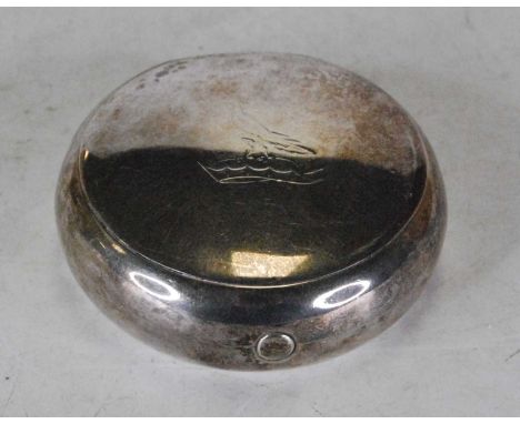 A George V silver pocket snuff box of compressed circular form, the spring loaded hinged cover engraved with a bird above a c