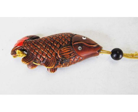 A reproduction two-section inro in the form of a carp, with further matching carp netsuke